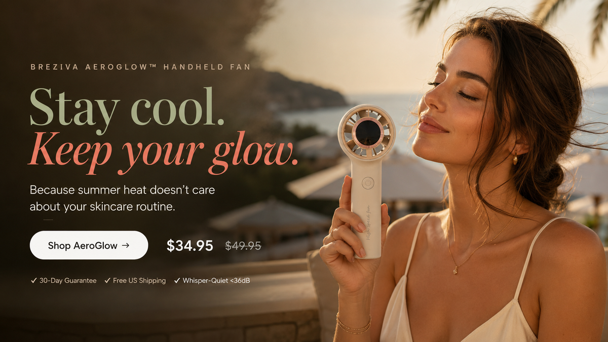 Woman holding the Breziva AeroGlow handheld cooling fan on a sunny summer day